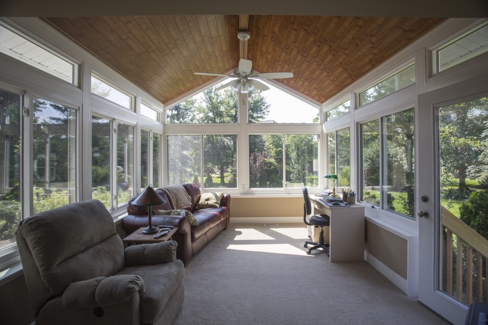 This is an example of a large contemporary sunroom in Columbus.