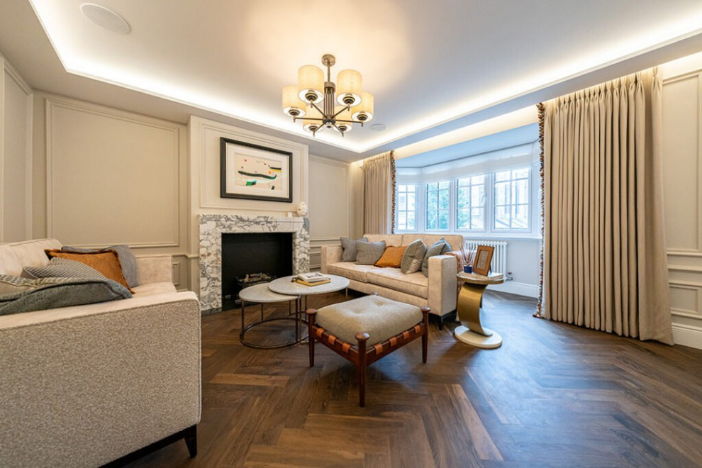 Large contemporary formal enclosed living room in London with white walls, vinyl floors, a standard fireplace, a concrete fireplace surround, no tv, beige floor, wood and decorative wall panelling.