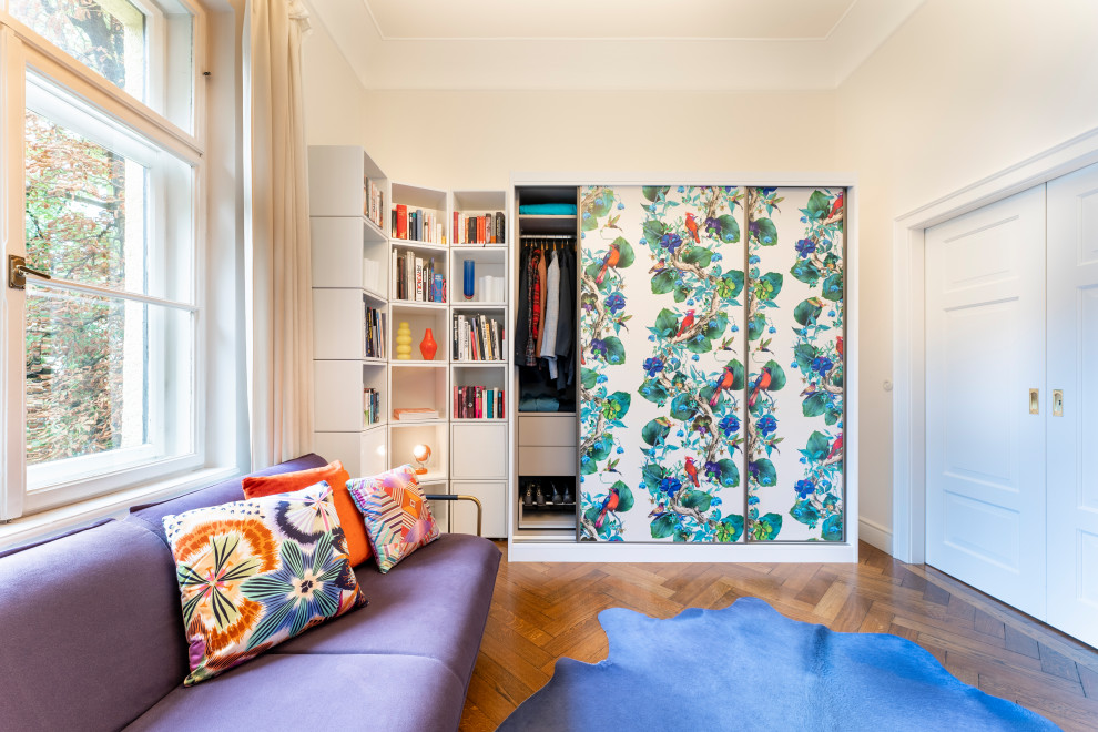 Bedroom - mid-sized eclectic guest medium tone wood floor and brown floor bedroom idea in Munich with beige walls