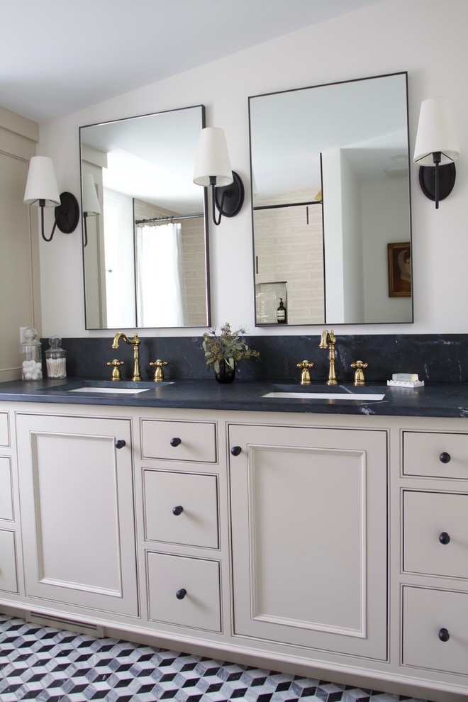 This is an example of a mid-sized eclectic master bathroom in Minneapolis with beaded inset cabinets, beige cabinets, beige tile, soapstone benchtops and black benchtops.