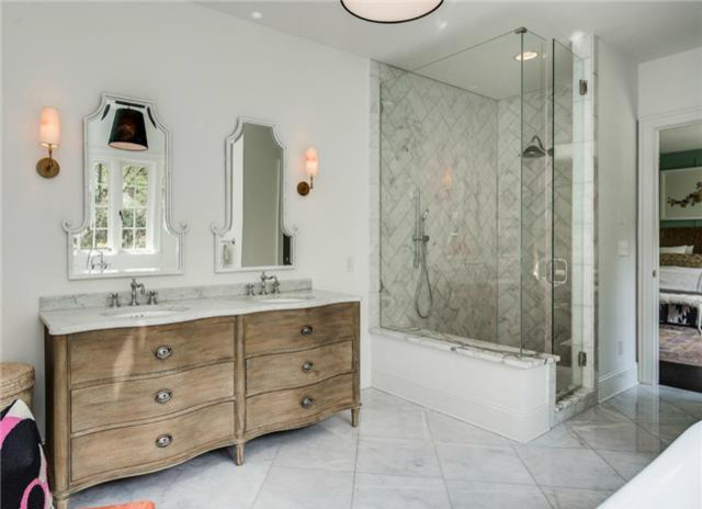 Design ideas for a traditional master bathroom in Charlotte with furniture-like cabinets, light wood cabinets, marble benchtops, an open shower, white tile and white walls.