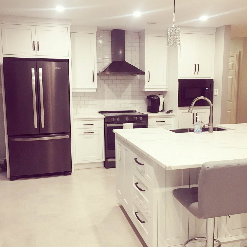 Mid-sized transitional u-shaped porcelain tile and white floor eat-in kitchen photo with a farmhouse sink, shaker cabinets, white cabinets, quartzite countertops, white backsplash, subway tile backsplash, stainless steel appliances, an island and white countertops