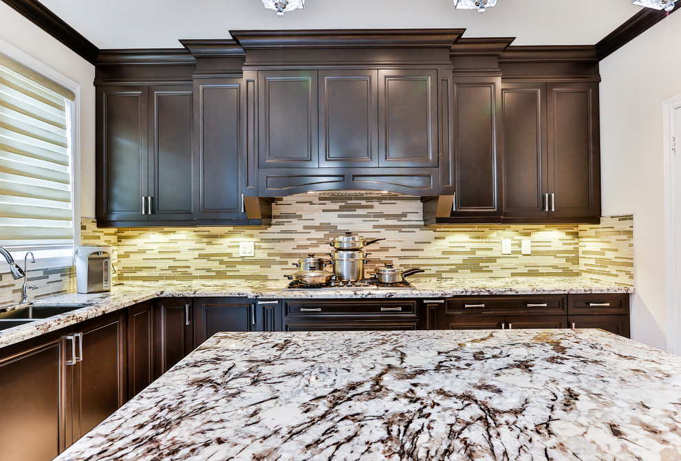 Example of a transitional kitchen design in Toronto