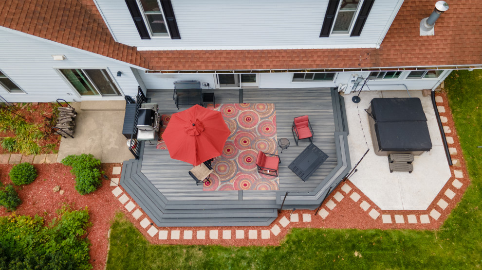 Deck - mid-sized transitional backyard metal railing deck idea with a bbq area