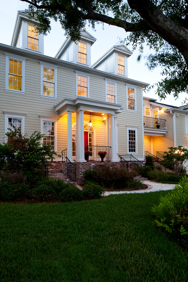 This is an example of a traditional two-storey beige exterior in Tampa.