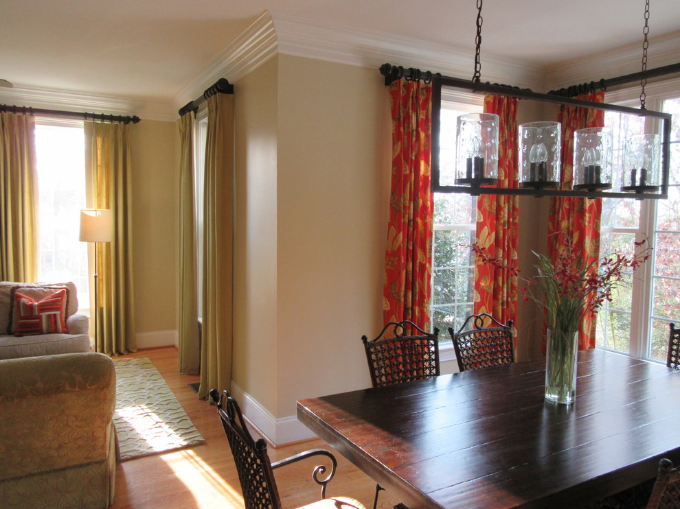 Example of a mid-sized transitional medium tone wood floor and beige floor great room design with beige walls and no fireplace