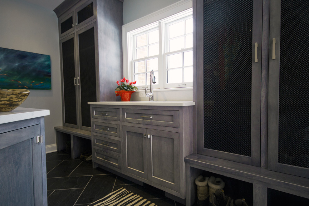 Mudroom - mid-sized transitional slate floor mudroom idea in Cleveland with blue walls and a white front door