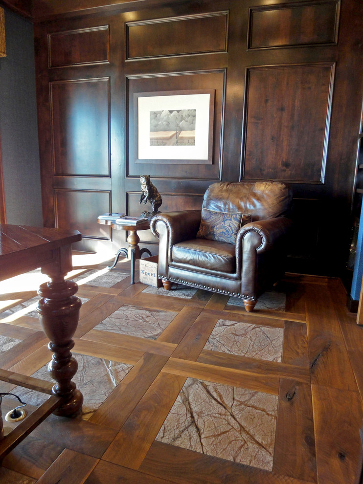 Example of a classic freestanding desk dark wood floor home office design in Kansas City with brown walls