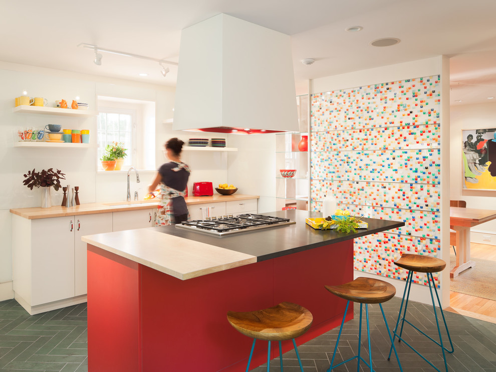 Mid-sized trendy galley slate floor eat-in kitchen photo in Philadelphia with an undermount sink, flat-panel cabinets, white cabinets, wood countertops, an island and white backsplash