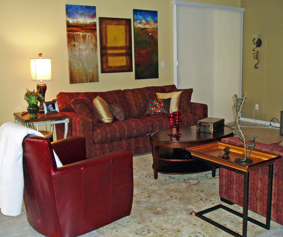 Photo of a mid-sized eclectic open concept living room in Phoenix with yellow walls, ceramic floors, no fireplace and a wall-mounted tv.