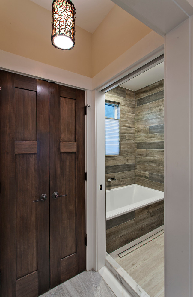 Small asian master bathroom in DC Metro with a drop-in tub, an open shower, brown tile, porcelain tile, brown walls, porcelain floors, beige floor and an open shower.