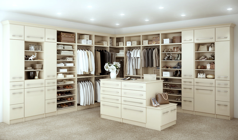 Example of a large transitional gender-neutral carpeted and beige floor walk-in closet design in Other with flat-panel cabinets and beige cabinets
