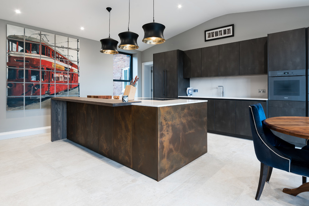Industrial galley eat-in kitchen in Sussex with flat-panel cabinets, brown cabinets, white splashback, black appliances, with island, white floor and white benchtop.