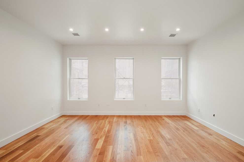 Living room - contemporary medium tone wood floor living room idea in New York