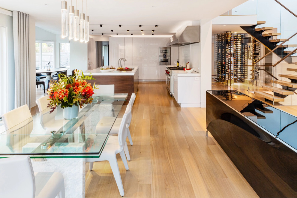 Inspiration for a contemporary kitchen/dining combo in Boston with light hardwood floors.