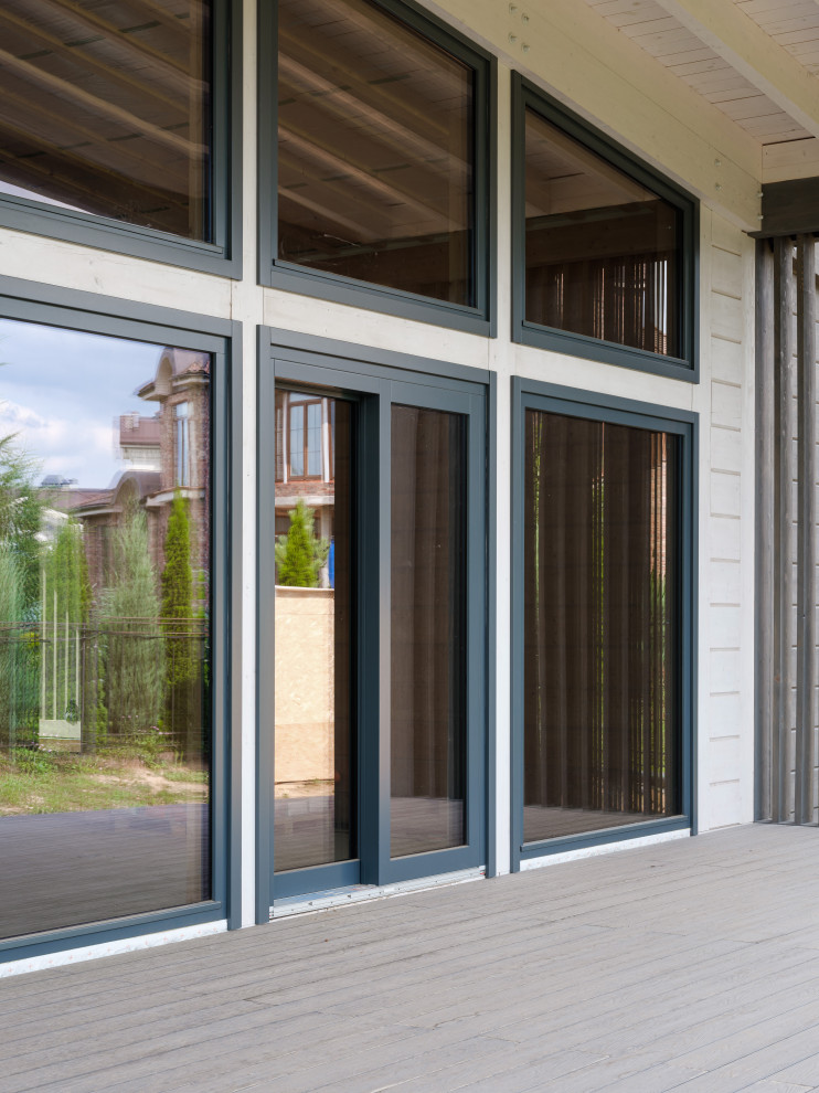 Трапецевидные окна, порталы и входные двери для современного дома