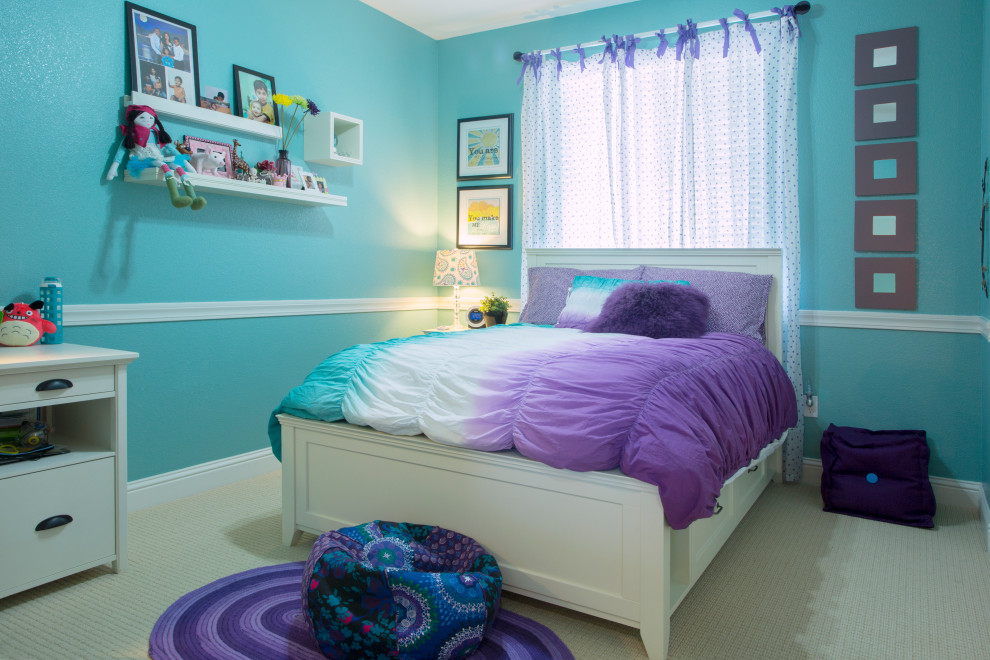 This is an example of a mid-sized contemporary kids' room for girls in San Francisco with blue walls, carpet and white floor.