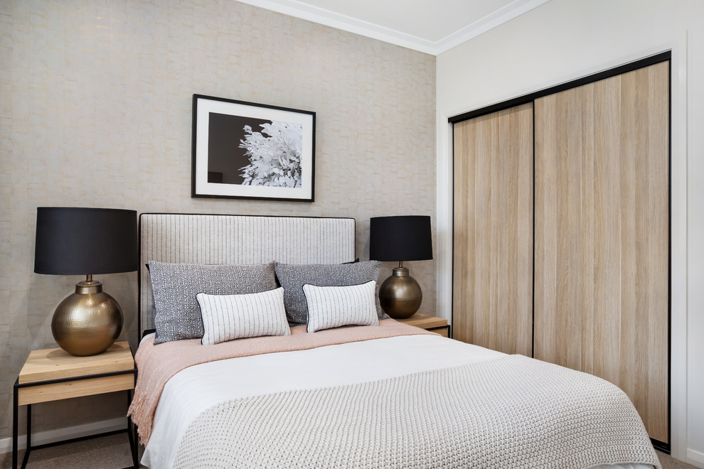 Contemporary guest bedroom in Sydney with beige walls, carpet and beige floor.
