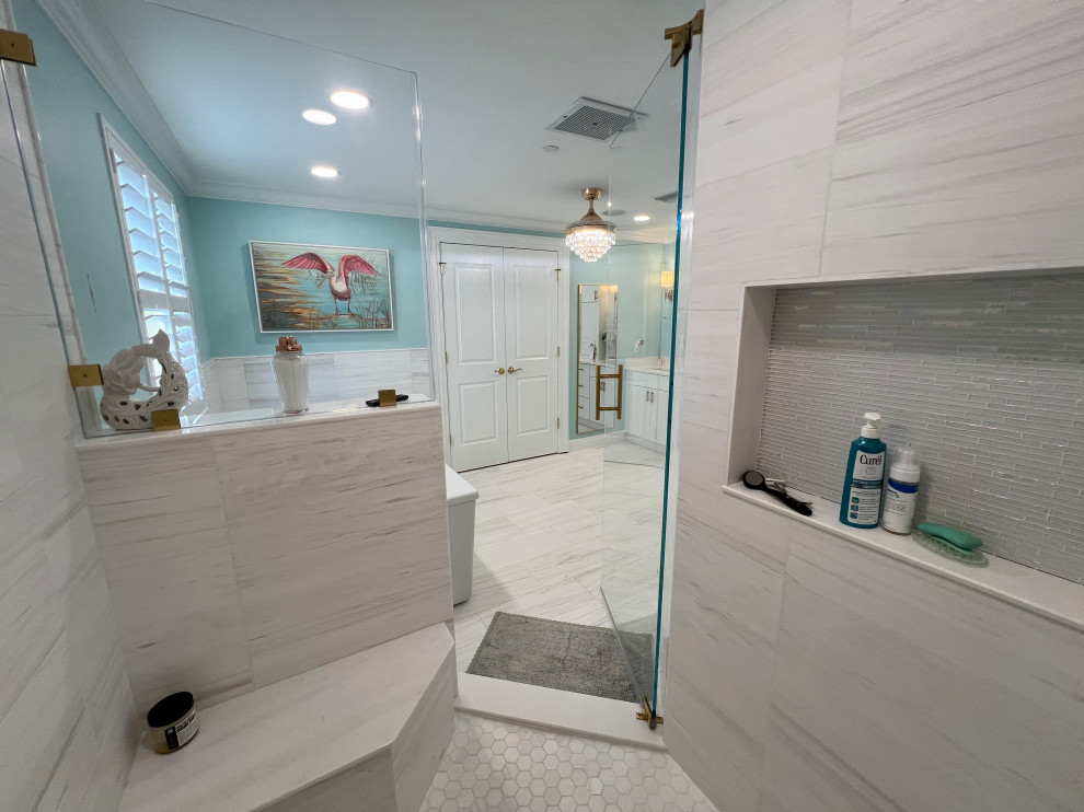 Example of a large mid-century modern master green tile and marble tile marble floor, multicolored floor and double-sink bathroom design in Tampa with flat-panel cabinets, white cabinets, a one-piece toilet, green walls, an undermount sink, quartzite countertops, a hinged shower door, white countertops and a built-in vanity