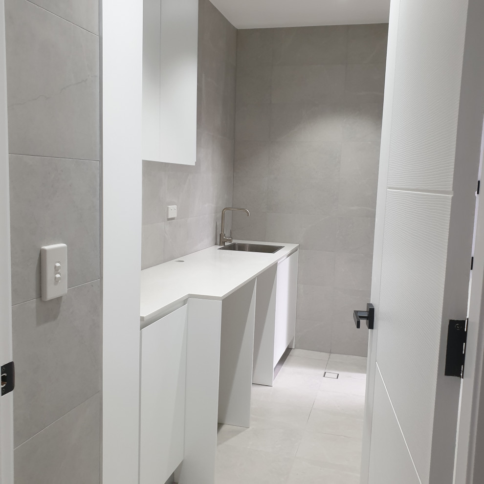 Photo of a contemporary laundry room in Sydney.