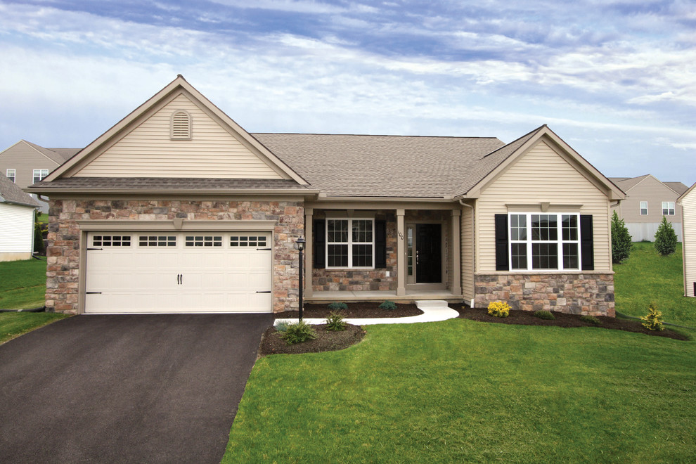 Home design - mid-sized traditional two-story beige home design idea