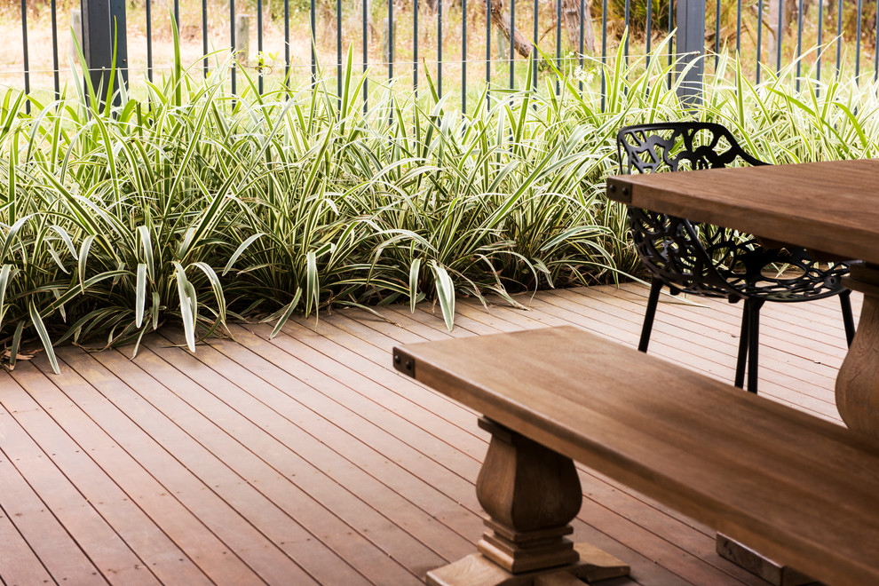 Design ideas for a large contemporary backyard full sun formal garden in Perth with decking.