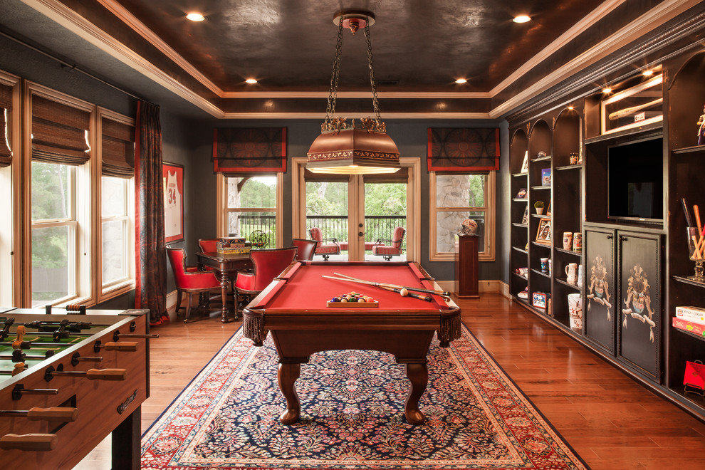Large traditional enclosed family room in Houston with a game room, grey walls, medium hardwood floors, no fireplace, a built-in media wall and brown floor.