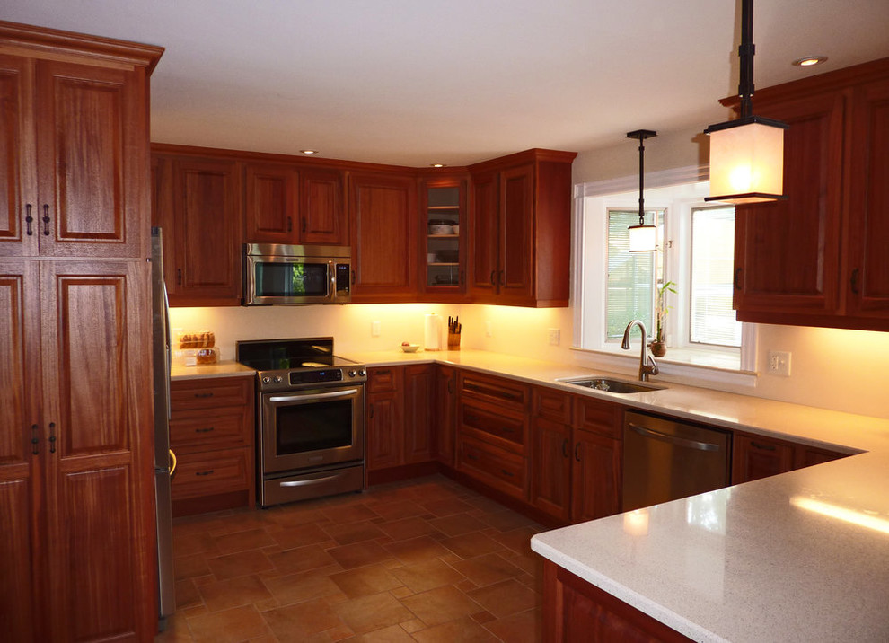Open concept kitchen - mid-sized transitional u-shaped ceramic tile and beige floor open concept kitchen idea with a single-bowl sink, raised-panel cabinets, medium tone wood cabinets, quartz countertops, stainless steel appliances, a peninsula and beige countertops