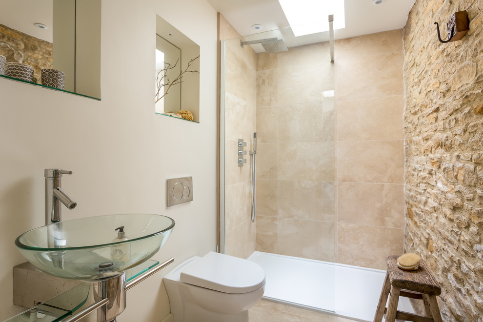 Inspiration for a small country 3/4 bathroom in Gloucestershire with beige tile, beige walls, beige floor, an alcove shower, a wall-mount toilet, a vessel sink and an open shower.