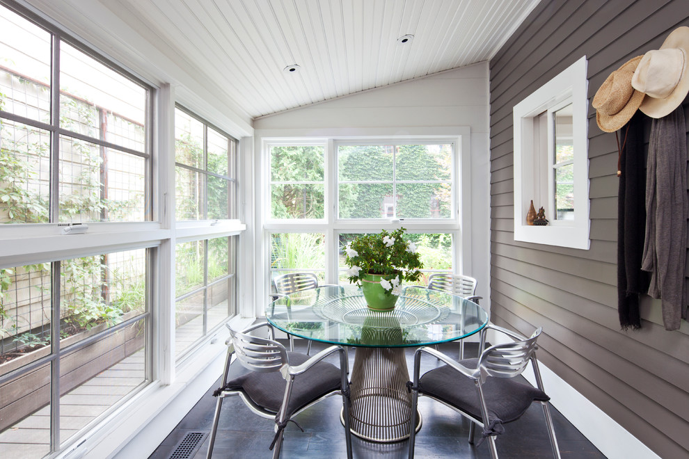 Transitional sunroom in New York with a standard ceiling and grey floor.