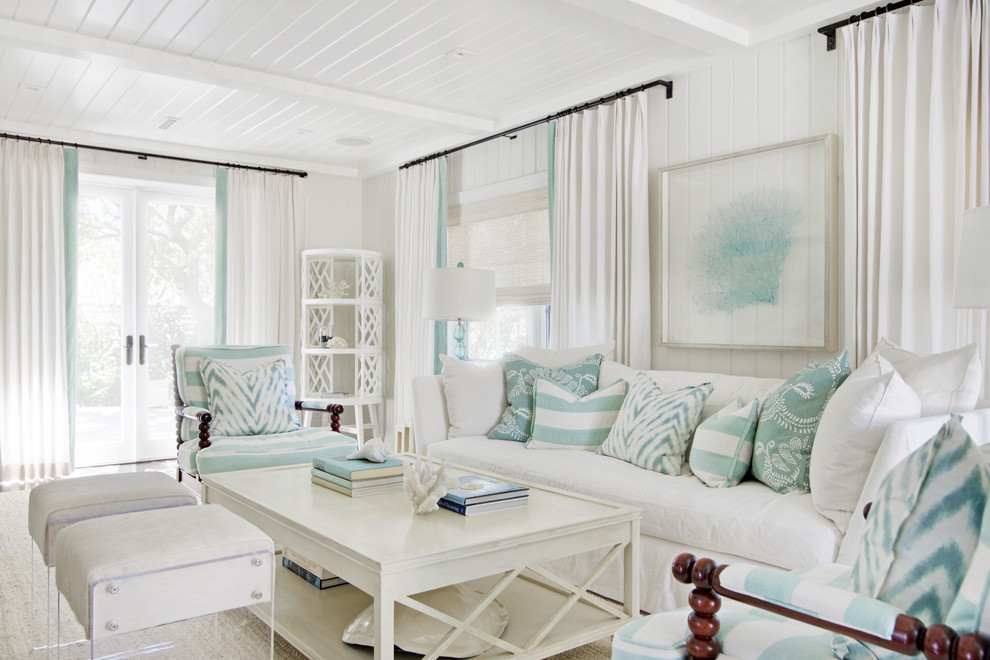 Photo of a beach style living room in Jacksonville with white walls.