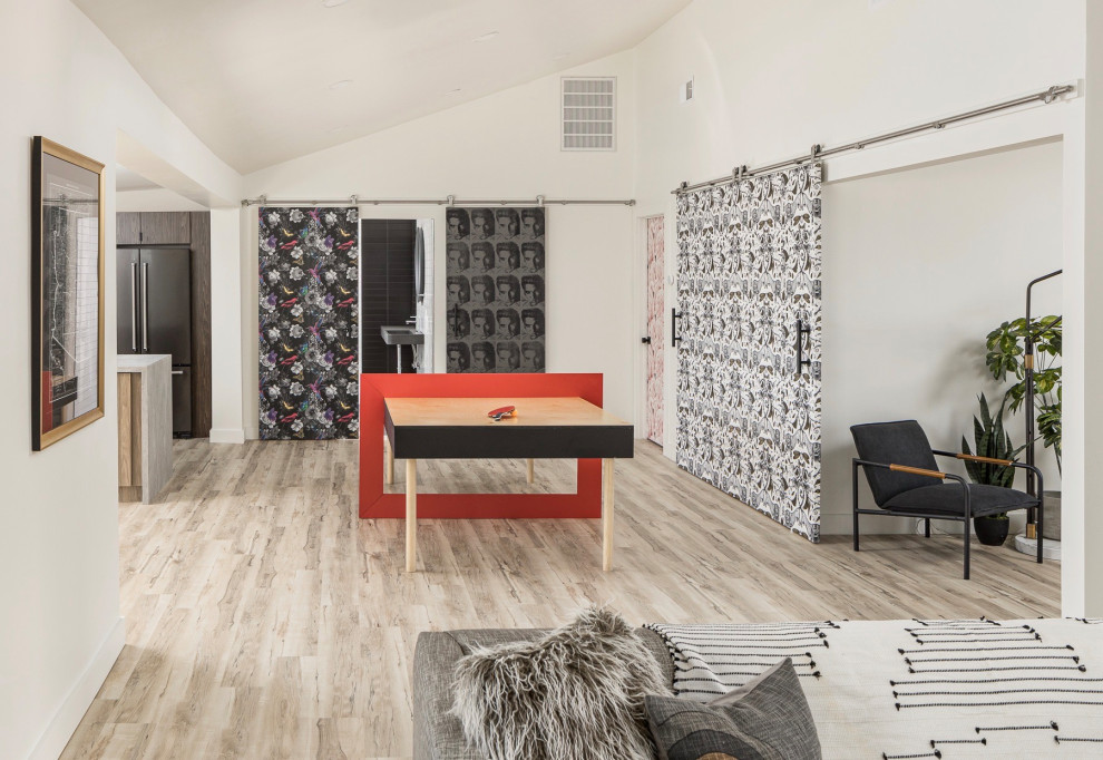 Example of a small trendy open concept light wood floor and beige floor game room design in Phoenix with white walls
