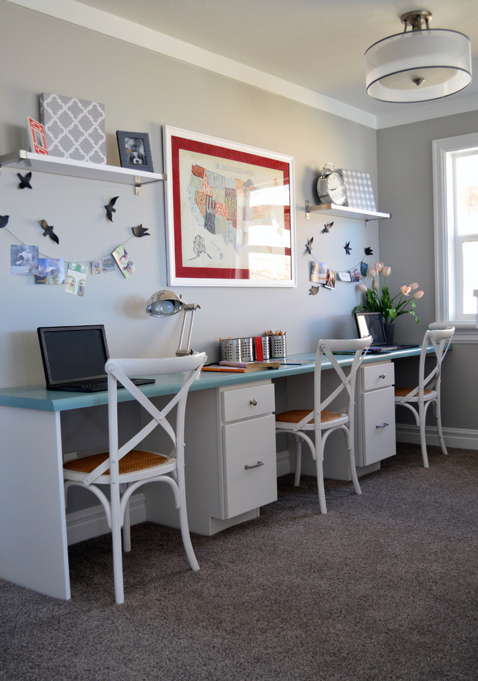 Large transitional gender-neutral kids' study room in Salt Lake City with carpet and grey walls.