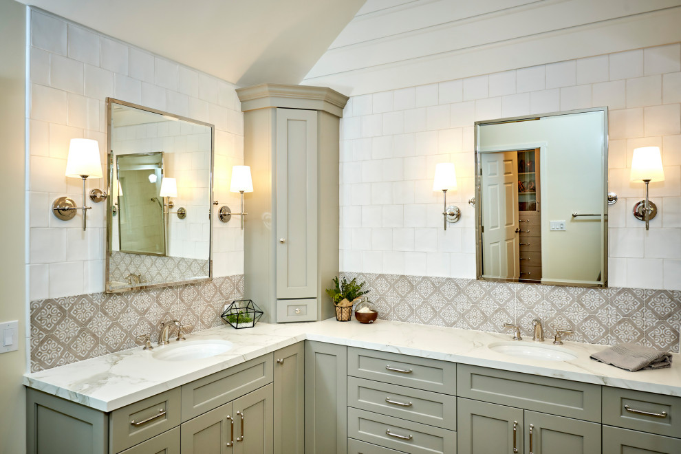 Example of a mid-sized master white tile and cement tile porcelain tile, brown floor, double-sink, exposed beam and shiplap wall bathroom design in San Diego with recessed-panel cabinets, green cabinets, a wall-mount toilet, white walls, an undermount sink, quartz countertops, a hinged shower door, white countertops and a built-in vanity
