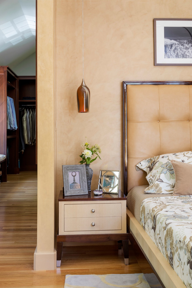 Inspiration for a large transitional master bedroom in Boston with blue walls and medium hardwood floors.