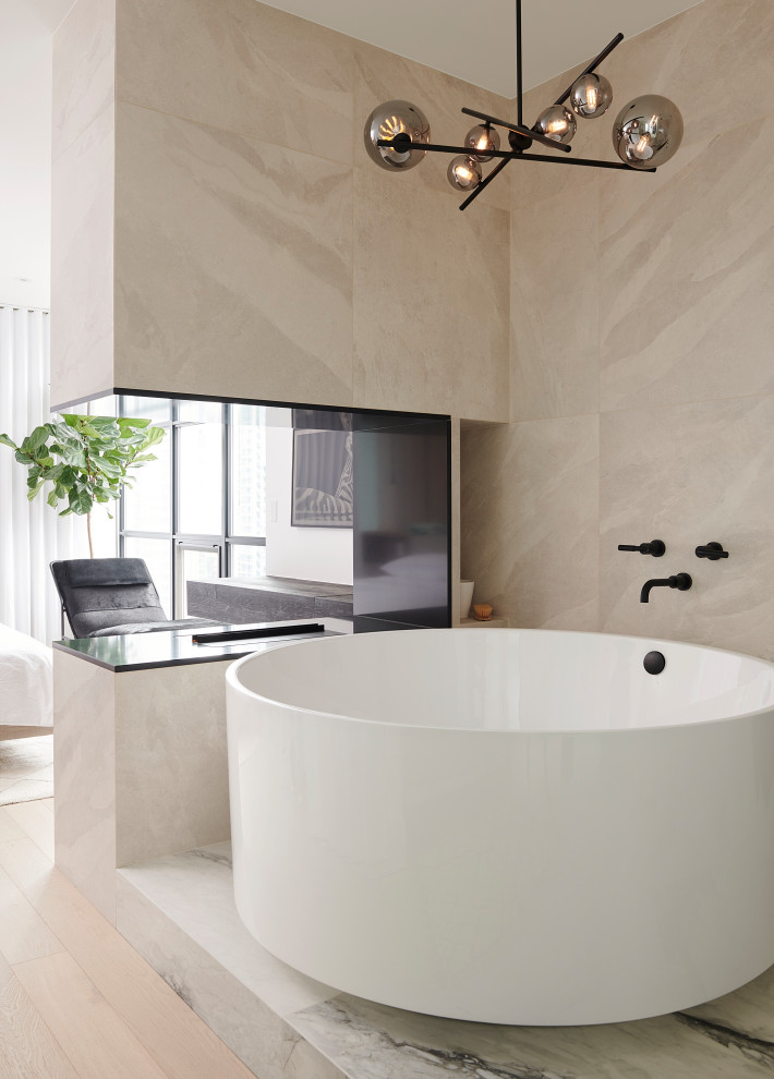 Inspiration for a medium sized contemporary ensuite bathroom in Toronto with flat-panel cabinets, white cabinets, a japanese bath, a corner shower, a bidet, beige tiles, porcelain tiles, white walls, light hardwood flooring, a vessel sink, engineered stone worktops, beige floors, a hinged door, beige worktops, an enclosed toilet, double sinks and a floating vanity unit.