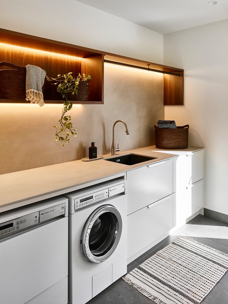 Design ideas for a mid-sized modern utility room in Brisbane.