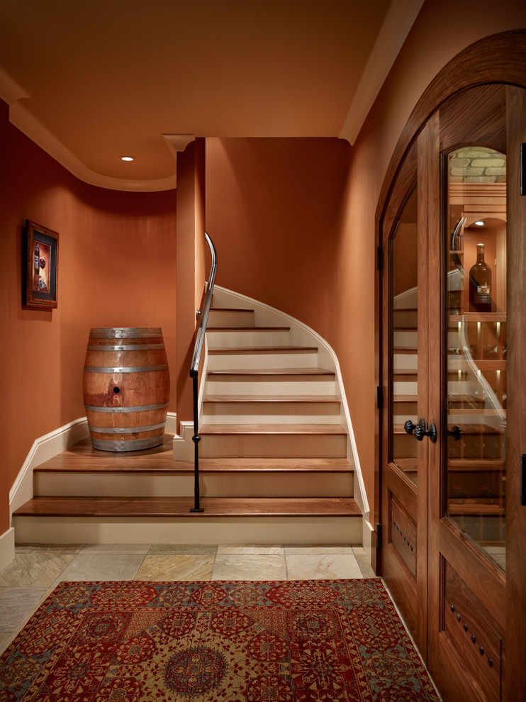 Photo of a mid-sized mediterranean wood curved staircase in Seattle with wood risers.