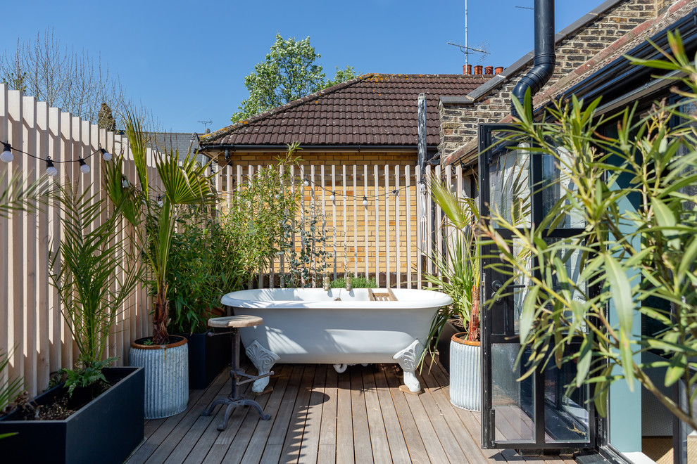Design ideas for an industrial rooftop deck in London with a container garden and no cover.