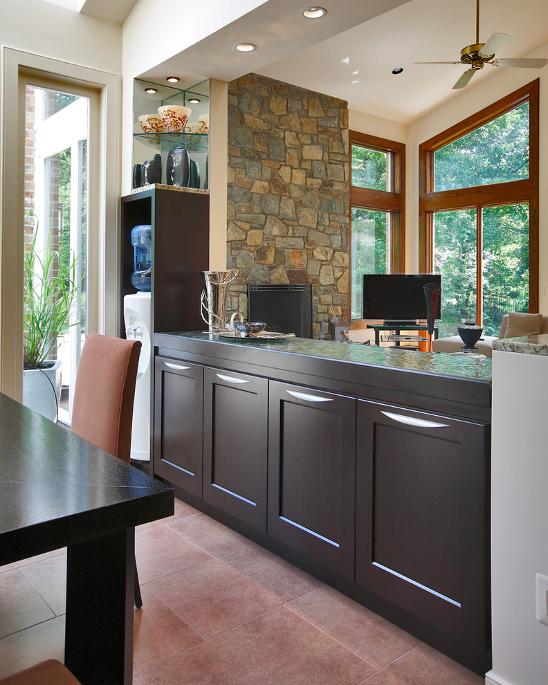 Large transitional u-shaped ceramic tile eat-in kitchen photo in DC Metro with an undermount sink, shaker cabinets, dark wood cabinets, granite countertops, yellow backsplash, glass sheet backsplash, stainless steel appliances and an island