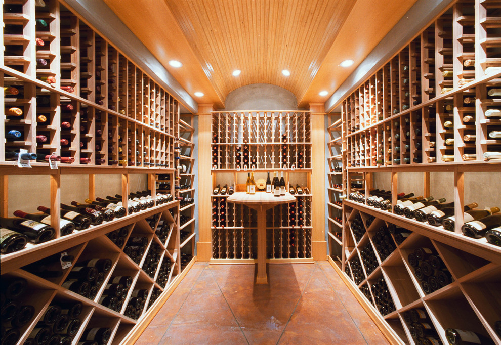 Photo of a traditional wine cellar in Portland with storage racks.