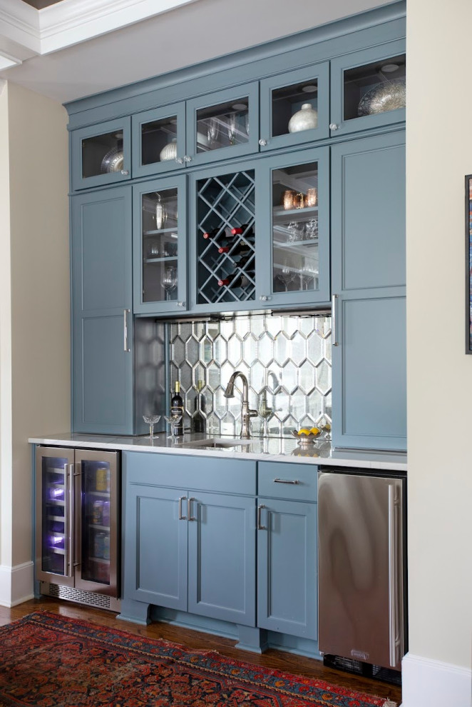 This is an example of a transitional home bar in Other with an undermount sink, shaker cabinets, blue cabinets, grey splashback and mirror splashback.
