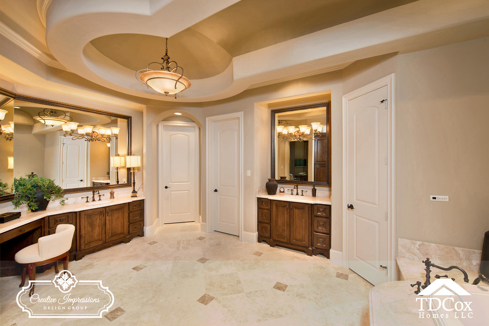 Large transitional master beige tile and marble tile travertine floor and beige floor alcove shower photo in Houston with shaker cabinets, medium tone wood cabinets, a two-piece toilet, an undermount sink, marble countertops and a hinged shower door