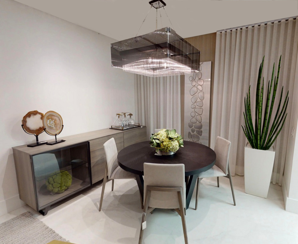 This is an example of a small contemporary dining room in Miami.