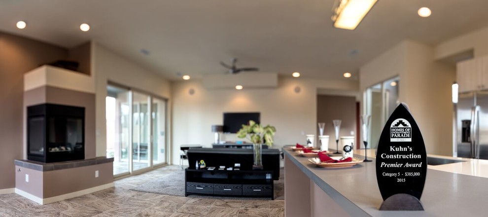 Inspiration for a mid-sized transitional galley open concept kitchen remodel in Orange County with an undermount sink, flat-panel cabinets, light wood cabinets, white backsplash, ceramic backsplash, stainless steel appliances and an island