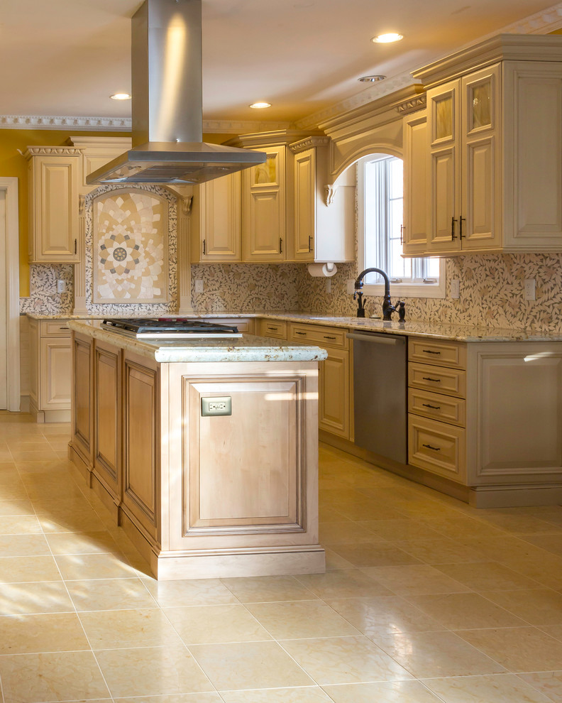 Kitchen - large transitional kitchen idea in Boston with raised-panel cabinets, light wood cabinets, granite countertops, stainless steel appliances and an island