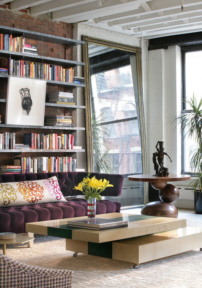 Inspiration for a contemporary open concept living room in New York with a library and white walls.
