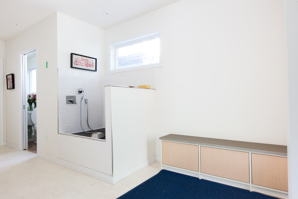 Example of a mid-sized trendy vinyl floor mudroom design in Minneapolis with white walls