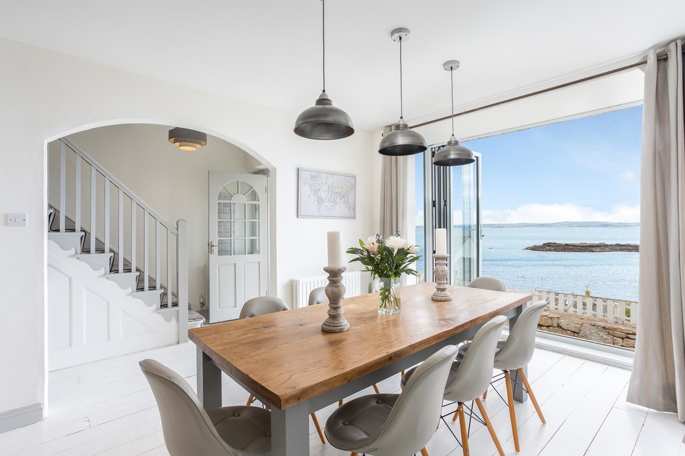 This is an example of a scandinavian dining room in Cornwall.