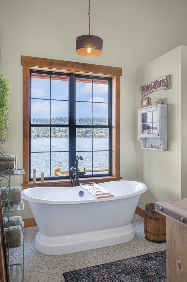 Inspiration for a mid-sized rustic master gray tile and porcelain tile porcelain tile, gray floor, double-sink and vaulted ceiling freestanding bathtub remodel in Seattle with shaker cabinets, green cabinets, a one-piece toilet, white walls, a drop-in sink, wood countertops, a hinged shower door, brown countertops and a built-in vanity